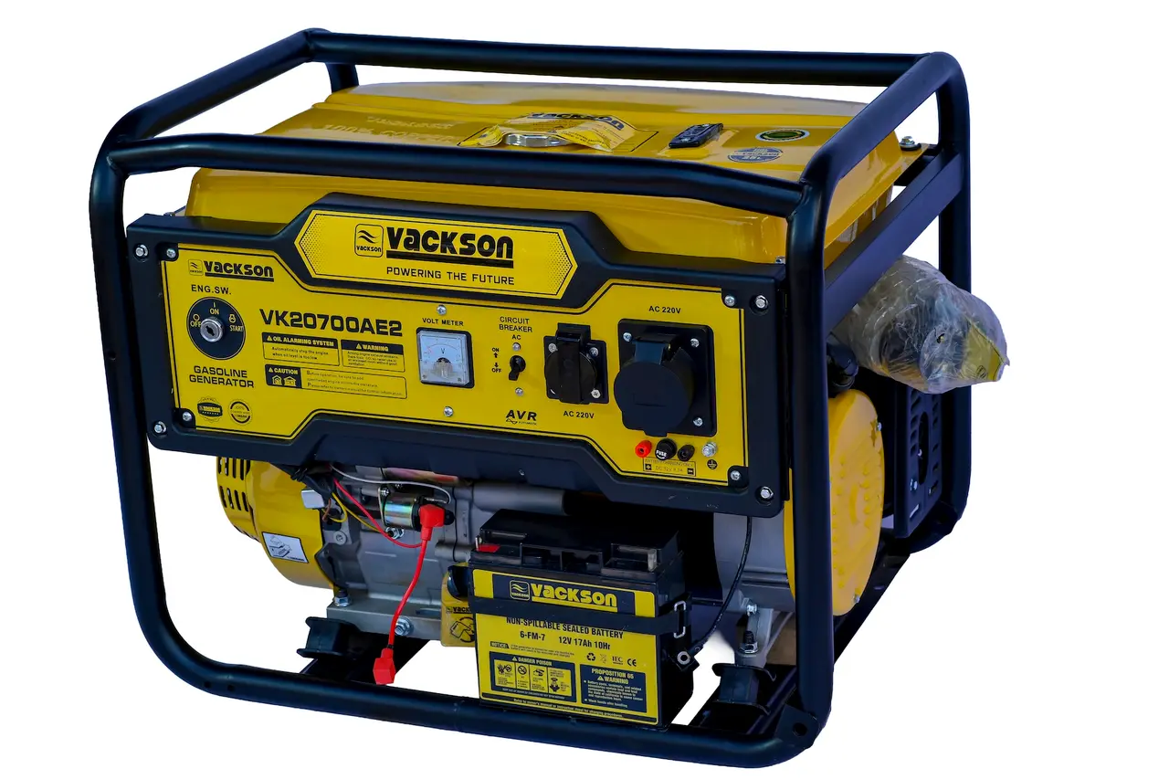 Angled shot of the Vackson 17HP petrol generator highlighting the large fuel tank, recoil starter, and 12V 17Ah battery.