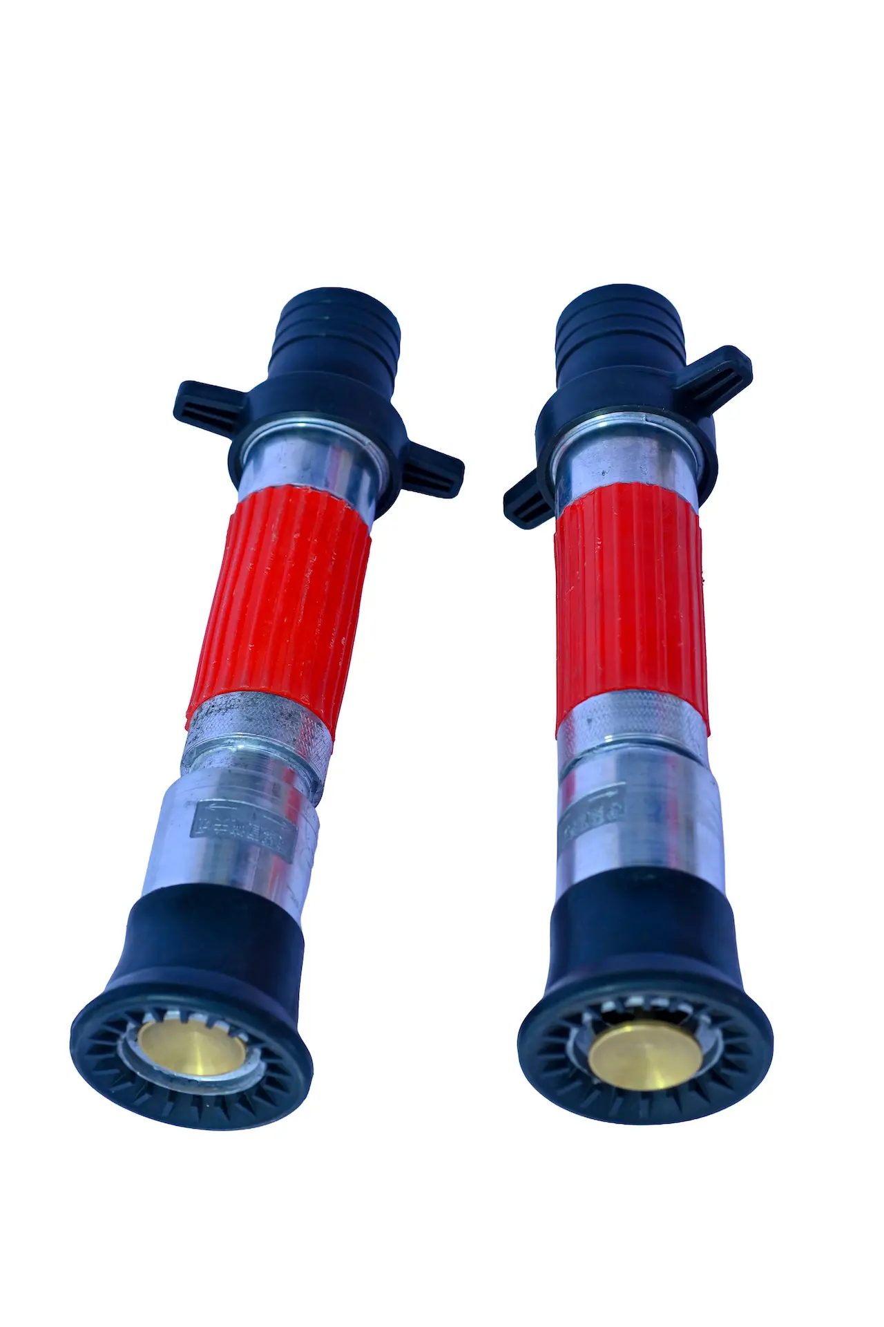 One adjustable jet spray fire hose nozzles with red grips and barbed connections